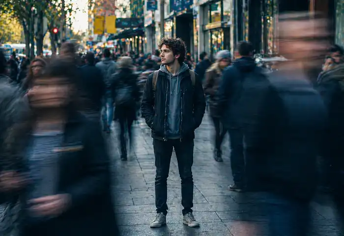 lone person in crowded city street