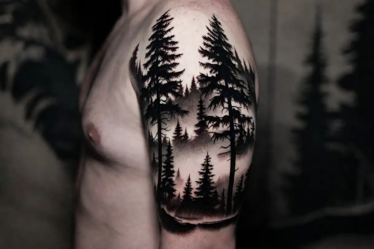 Blackwork forest landscape sleeve nature tattoo with pine trees and mist