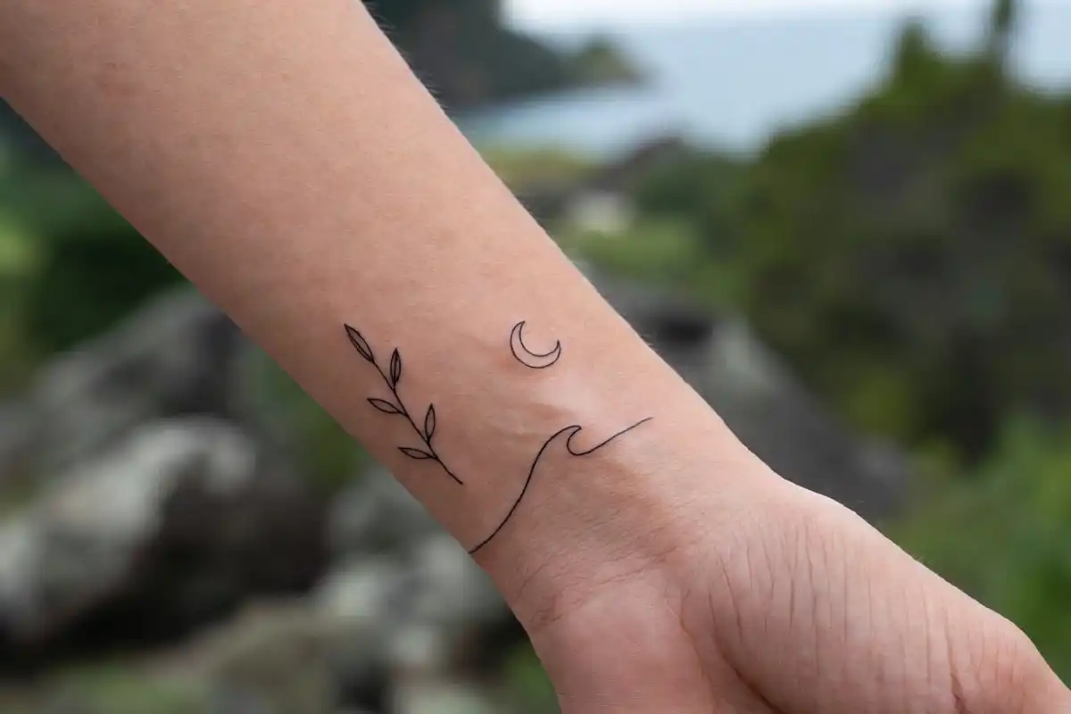 Small minimalist nature tattoo ideas including leaf moon and wave on wrist and ankle