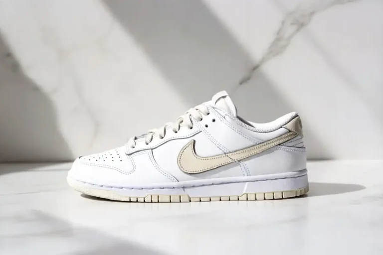 Nike Dunk Low Next Nature white sanddrift colorway on clean studio background