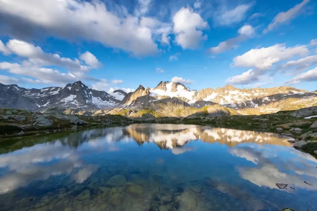 Mountain lake nature wallpaper for mobile with snow-capped peaks reflection
