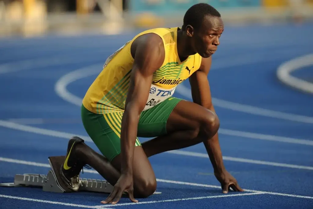 Sprinter set in the starting blocks showing focus and confidence before a race
