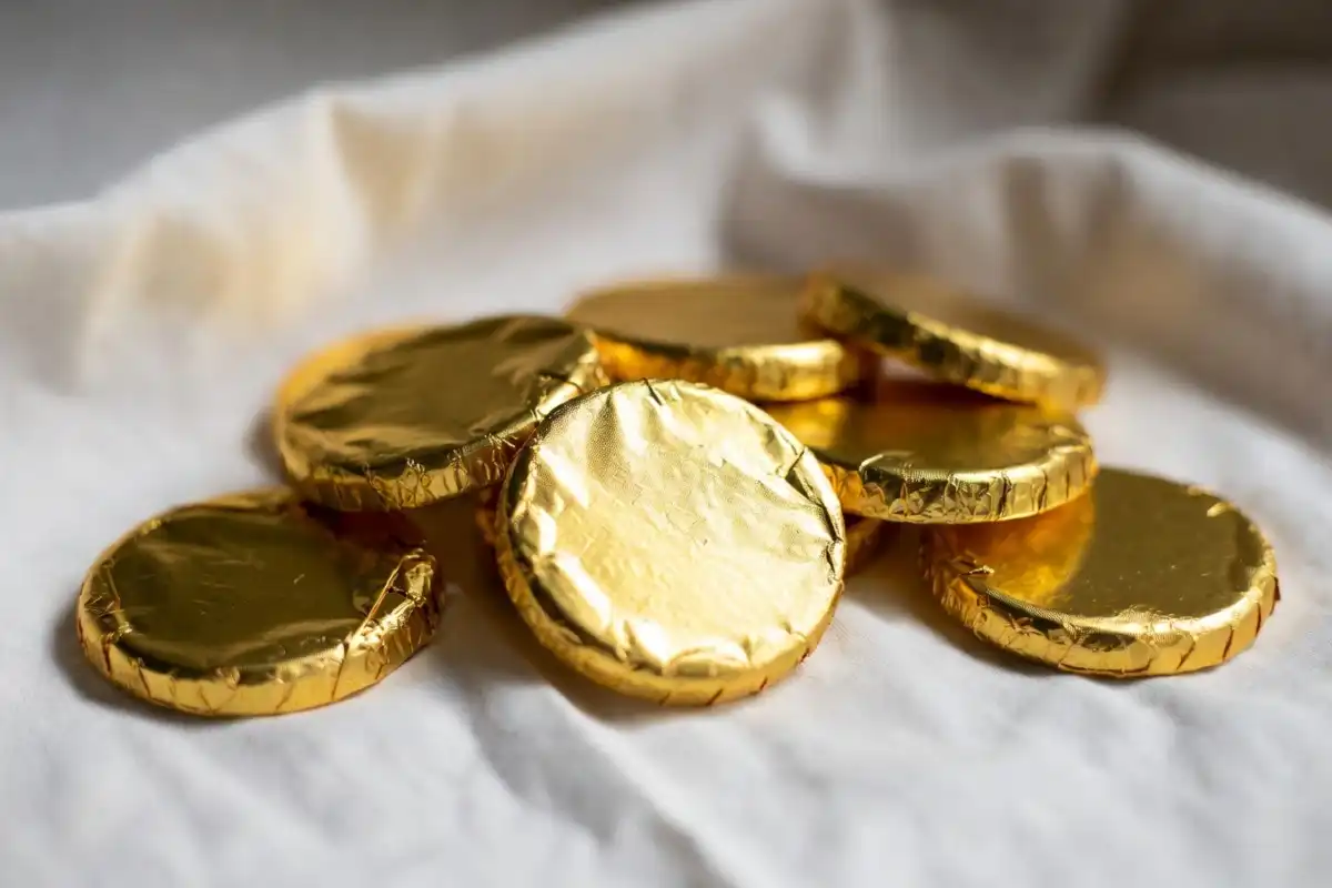Team USA Chocolate Medals wrapped in gold foil arranged on a clean white surface