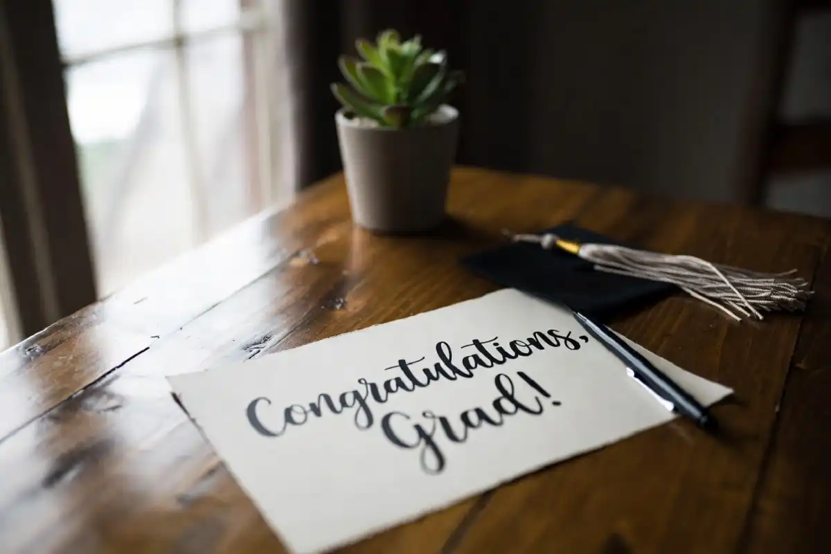 Handwritten graduation congratulations message on a card, an example of a personal graduation note