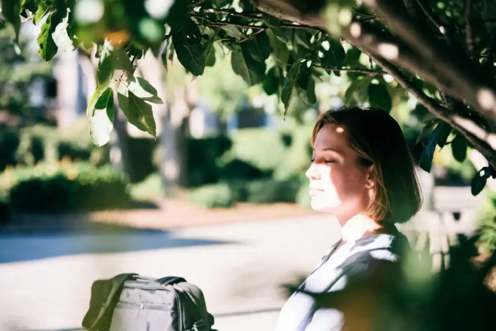 Person taking an outdoor break to protect productivity motivation